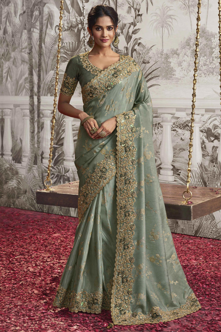 Creative Heavy Embroidery Work Sea Green Color Fancy Fabric Saree With Party Look Blouse