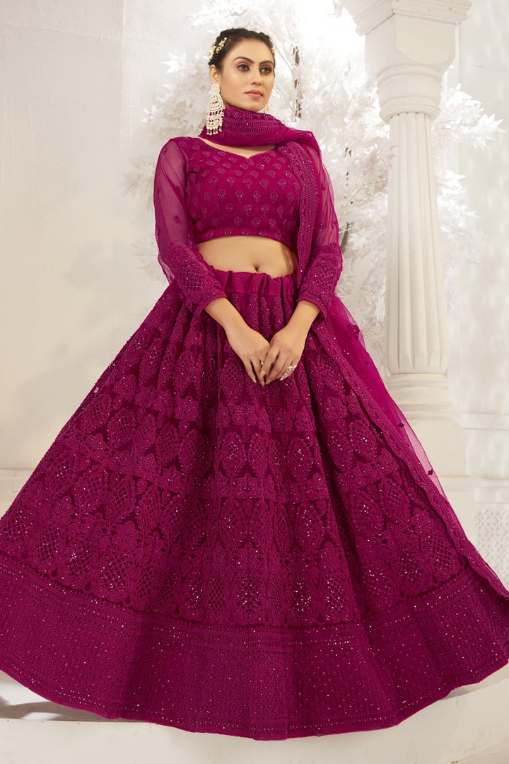 Embroidered Wedding Wear Lehenga Choli In Wine Color Net Fabric