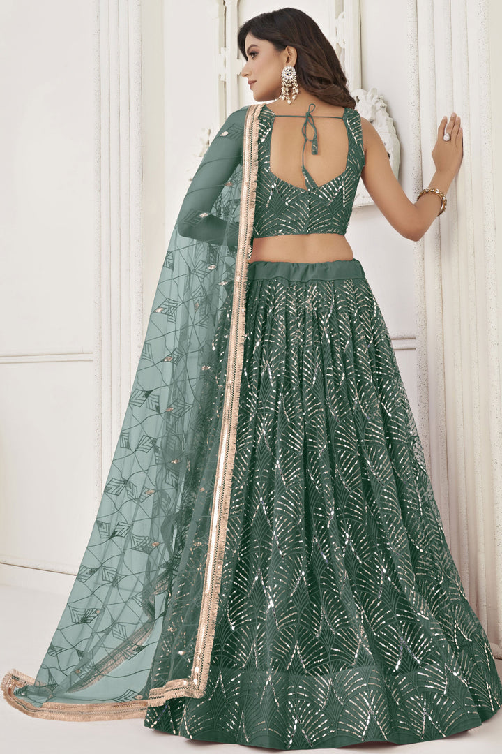 Phenomenal Sangeet Wear Dark Green Color Net Fabric Lehenga Choli
