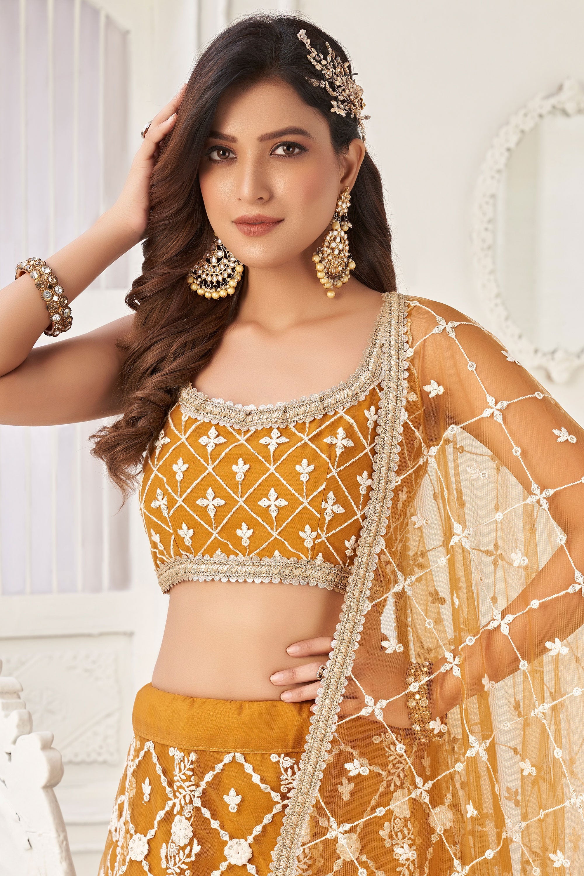 Mustard Color Net Wedding Wear Lehenga Choli With Embroidery Work