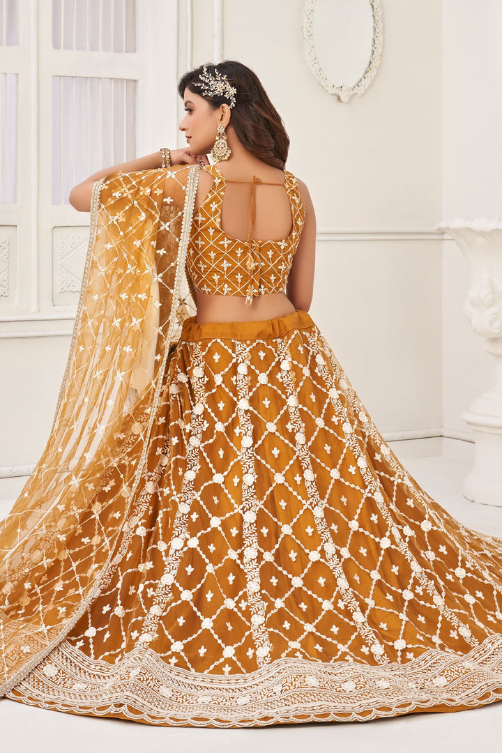 Mustard Color Net Wedding Wear Lehenga Choli With Embroidery Work