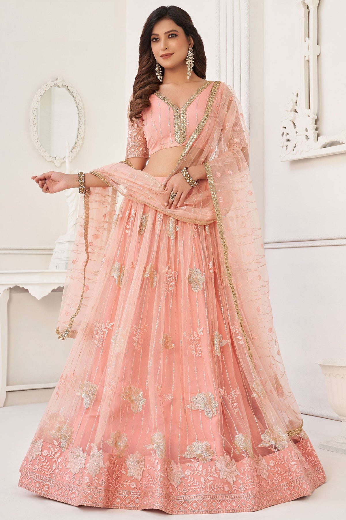 Embroidered Peach Net Fabric Sangeet Wear Lehenga Choli