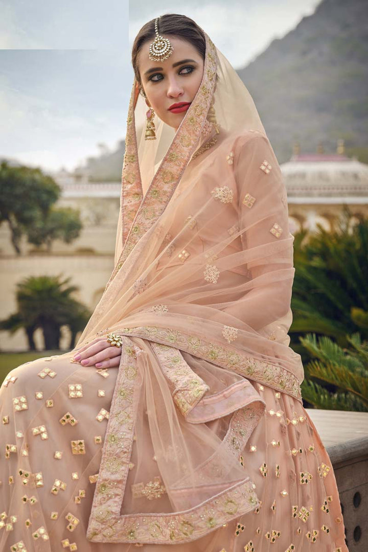 Sangeet Wear Peach Color Beautiful Embroidered Work Lehenga In Net Fabric