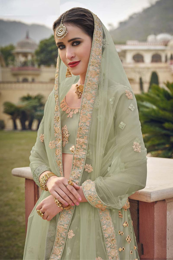 Sangeet Wear Embroidered Work Net Fabric Lehenga In Dazzling Sea Green Color