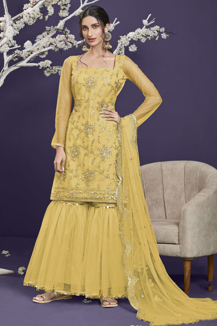 Net Fabric Party Wear Yellow Color Embroidered Designer Sharara Suit