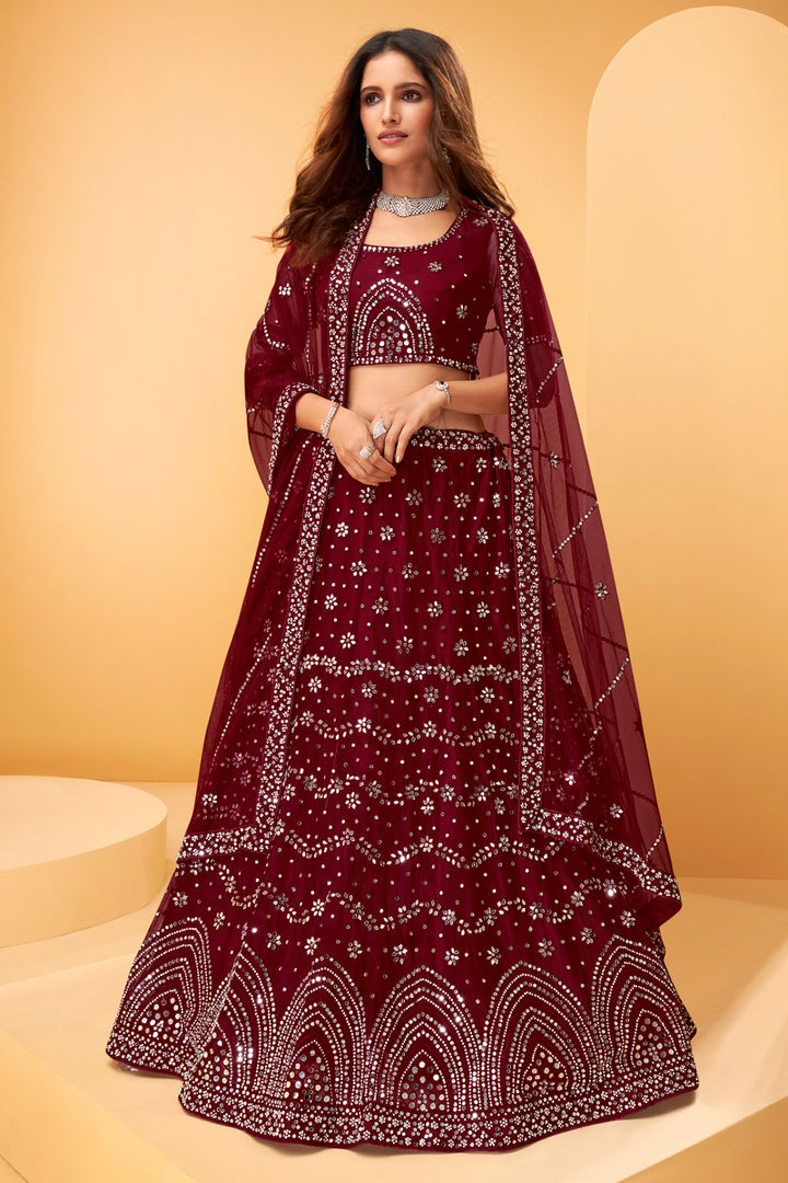 Wedding Wear Net Fabric Embroidered Lehenga Choli In Maroon Color