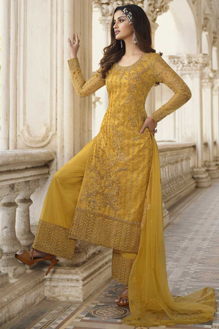 Party Wear Yellow Color Net Fabric Palazzo Suit With Fascinating Embroidered Work