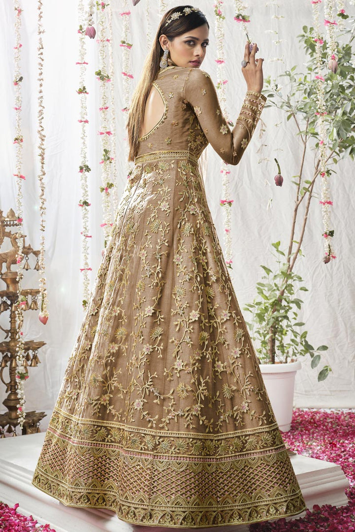 Fetching Net Fabric  Embroidered Anarkali Suit In Chikoo Color