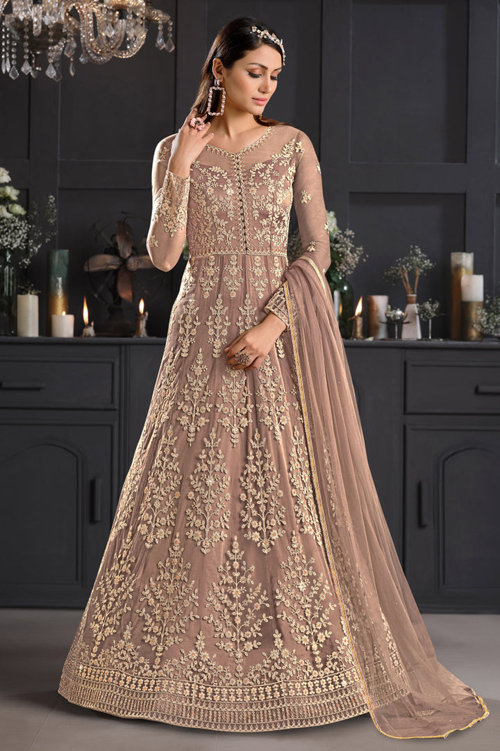 Net Fabric Embroidered Festive Wear Anarkali Salwar Kameez In Chikoo Color