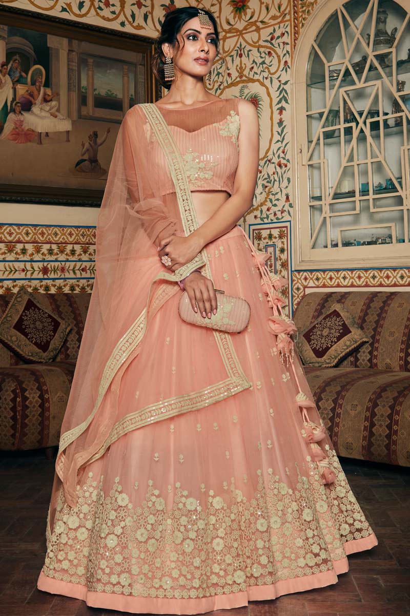 Magnificent Sangeet Wear Net Fabric Peach Color Embroidered Work Lehenga