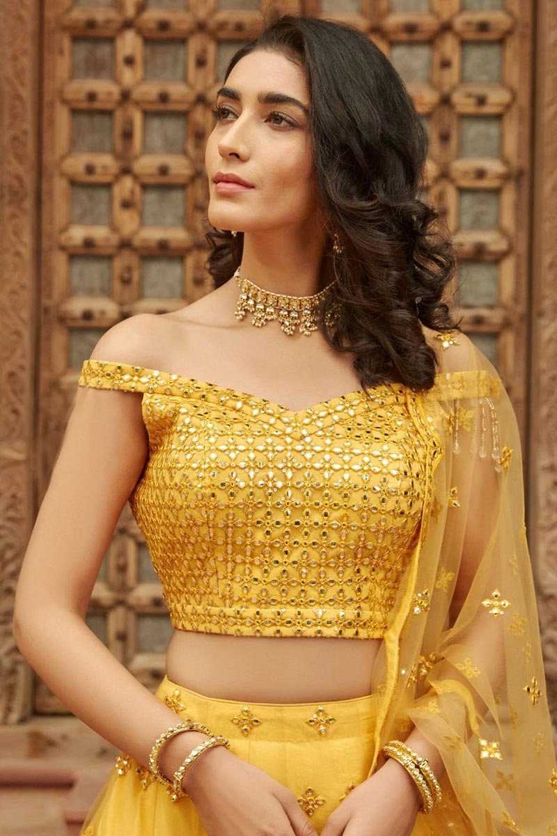 Organza Fabric Yellow Color Fetching Embroidered Function Wear Lehenga Choli