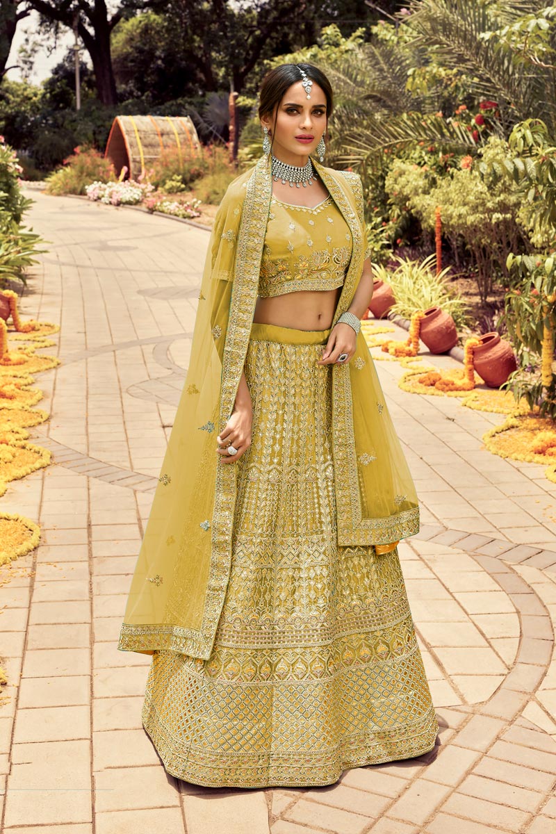 Art Silk Fabric Yellow Color Bridal Lehenga With Fascinating Embroidered Work