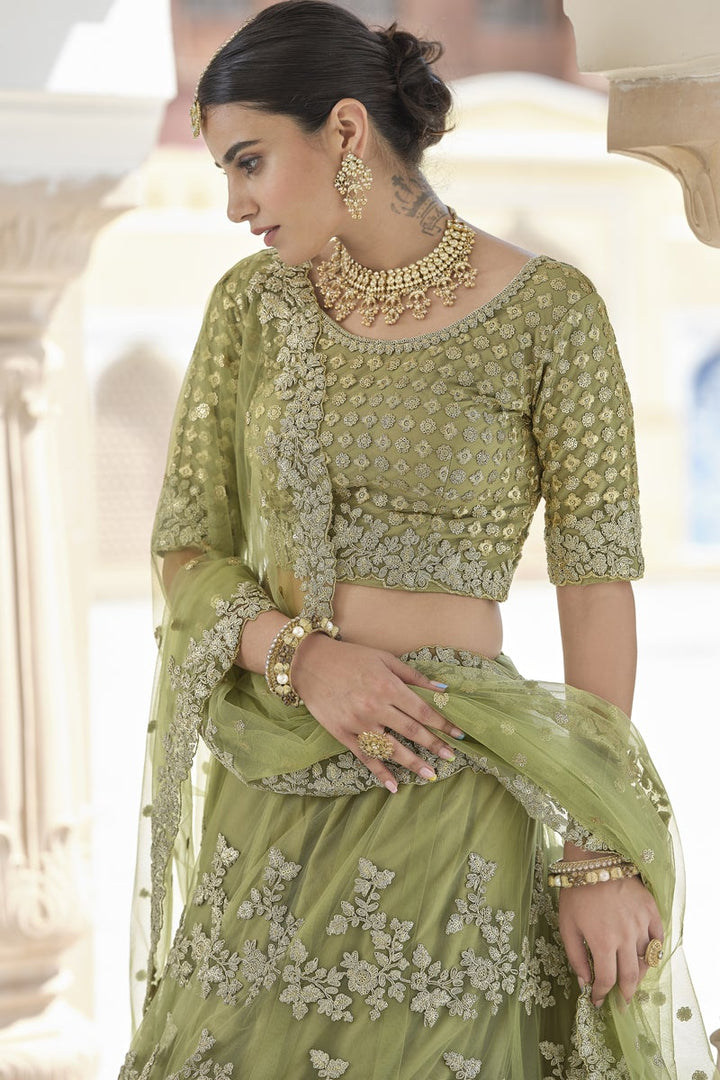 Net Fabric Sangeet Wear Green Color Embroidered Lehenga Choli