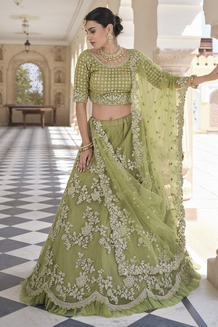 Net Fabric Sangeet Wear Green Color Embroidered Lehenga Choli