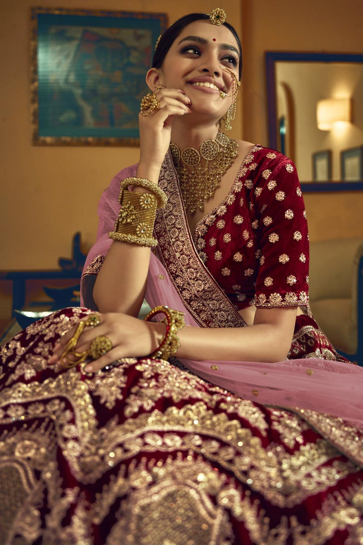 Wedding Wear Velvet Fabric Designer Embroidered Lehenga Choli In Maroon Color