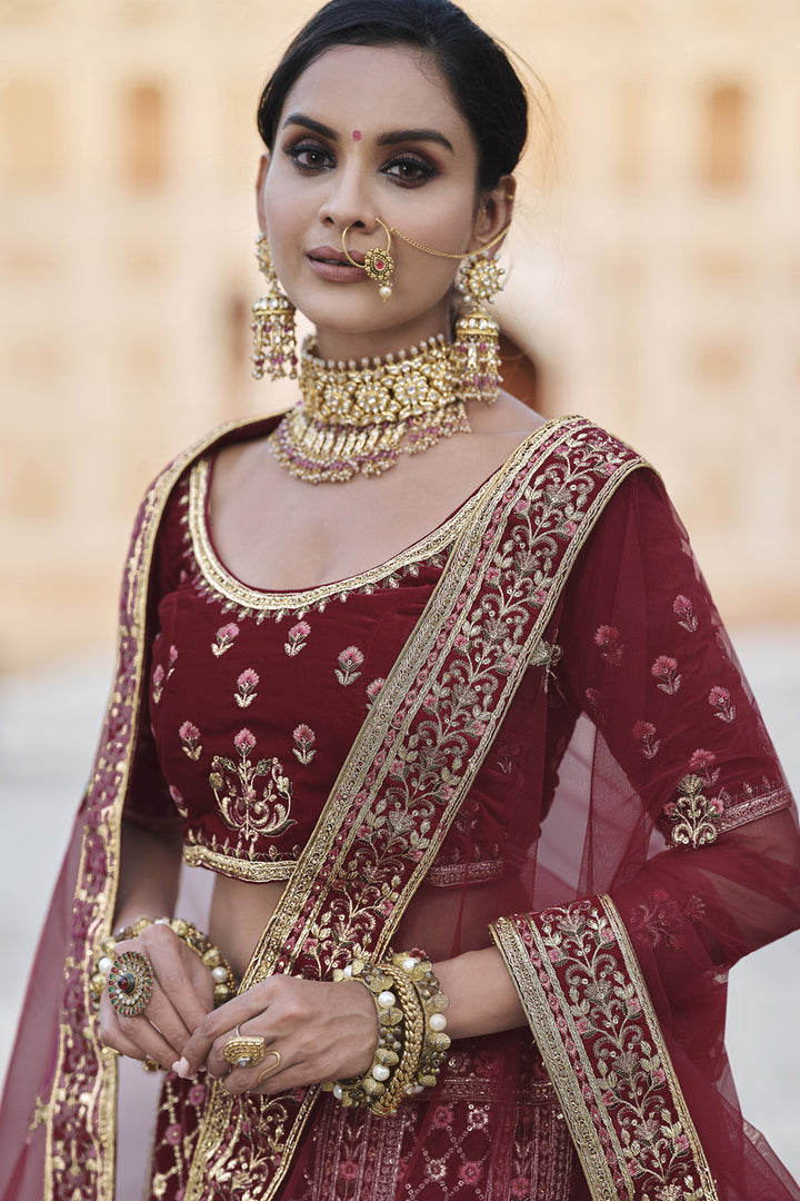 Velvet Heavy Embroidered Wedding Wear Designer Lehenga Choli In Maroon Color