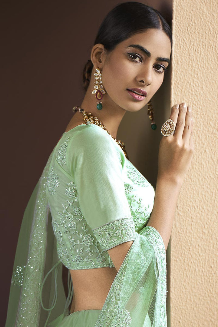 Net Fabric Fancy Wedding Wear Lehenga Choli In Sea Green Color