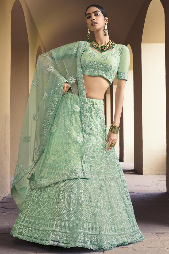 Net Fabric Fancy Wedding Wear Lehenga Choli In Sea Green Color
