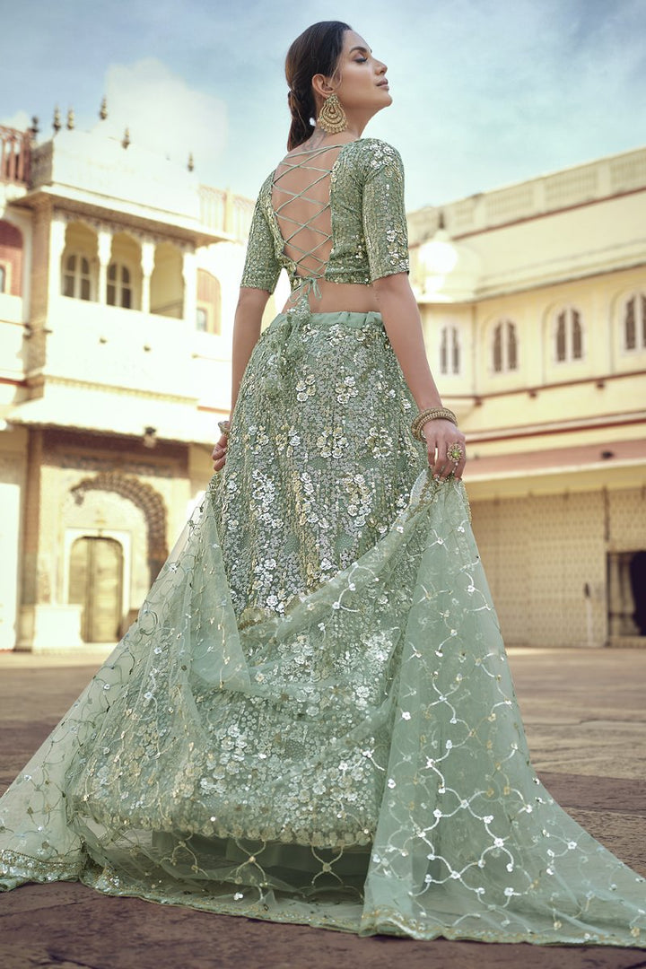 Net Fabric Reception Wear Sea Green Color Sequins Work Lehenga Choli