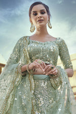 Load image into Gallery viewer, Net Fabric Reception Wear Sea Green Color Sequins Work Lehenga Choli
