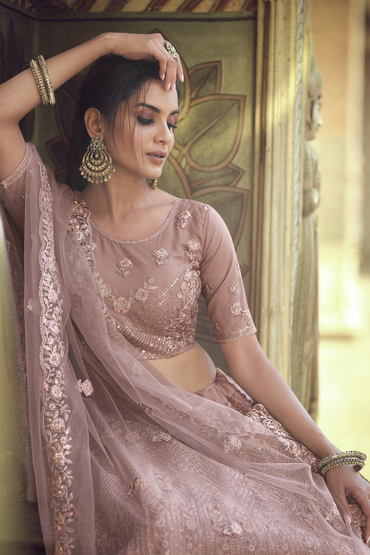 Wedding Wear Net Fabric Sequins Work Lehenga Choli In Pink Color