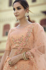 Load image into Gallery viewer, Reception Wear Net Fabric Peach Color Sequins Work Lehenga Choli
