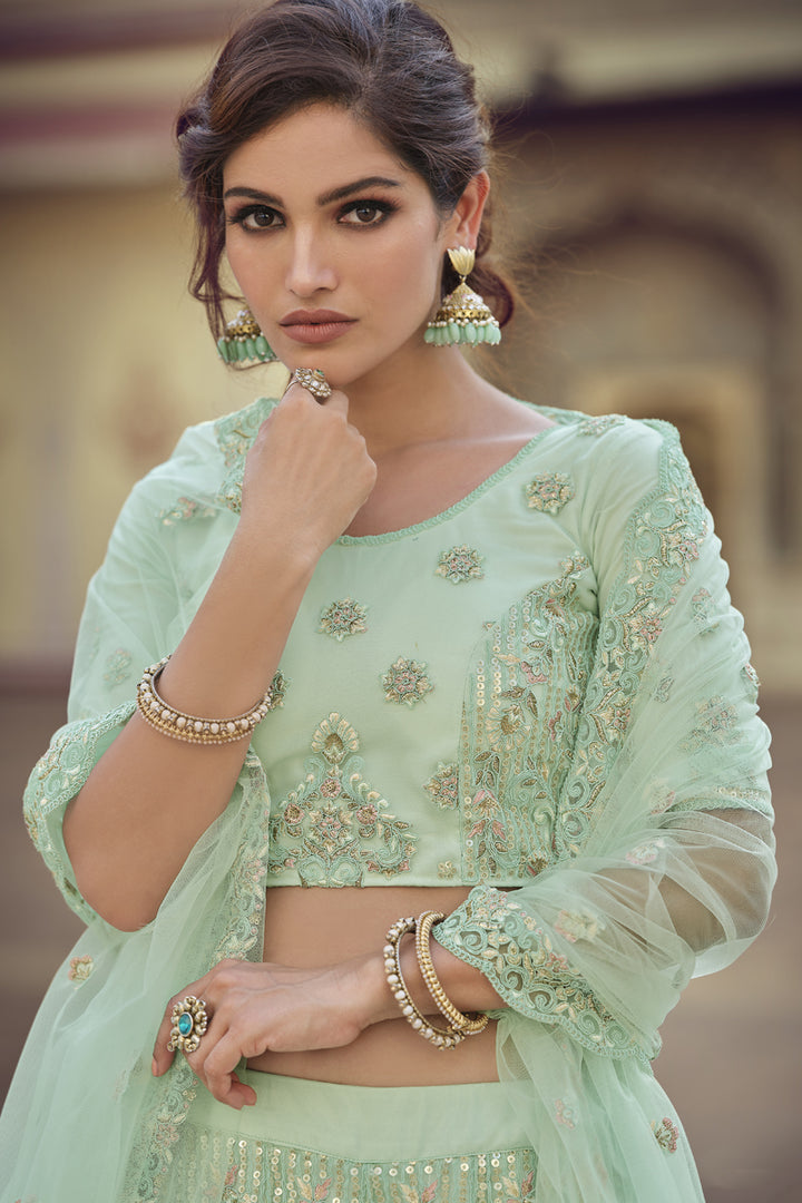 Net Fabric Sangeet Wear Sea Green Color Sequins Work Lehenga Choli