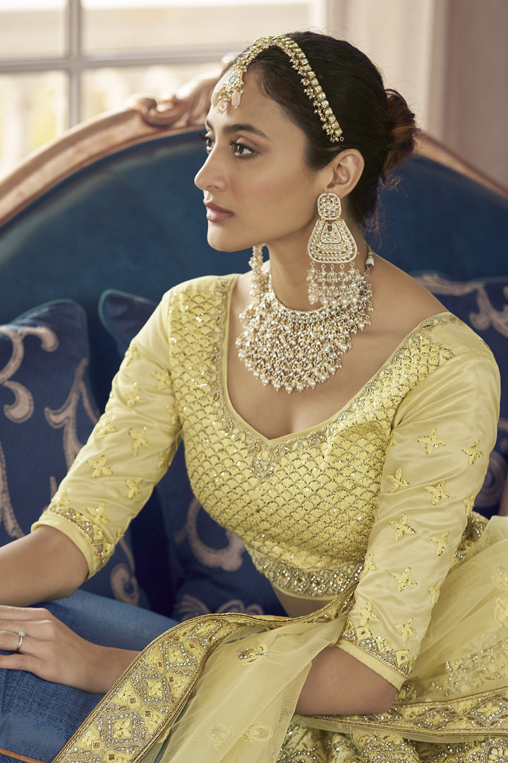 Stunning Crepe Fabric Thread Embroidered Wedding Wear Lehenga Choli In Yellow Color