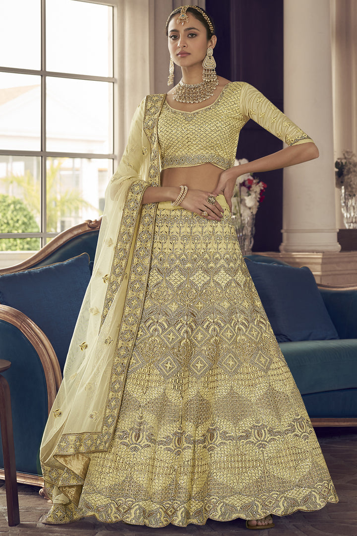 Stunning Crepe Fabric Thread Embroidered Wedding Wear Lehenga Choli In Yellow Color