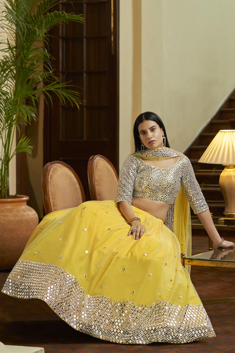 Sangeet Wear Net Fabric Chic Embroidered Lehenga Choli In Yellow Color