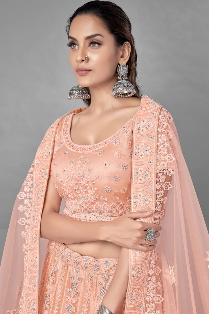 Peach Color Thread Embroidered Designer Wedding Wear Net Fabric Lehenga Choli
