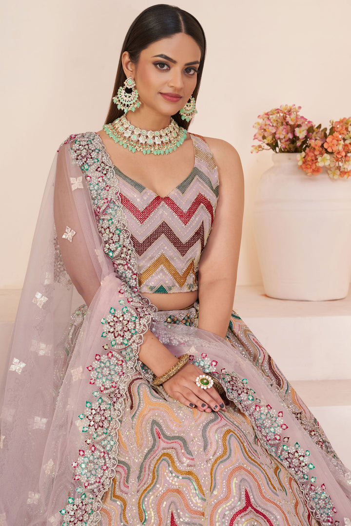 Embroidered Peach Color Bridal Lehenga Choli In Net Fabric