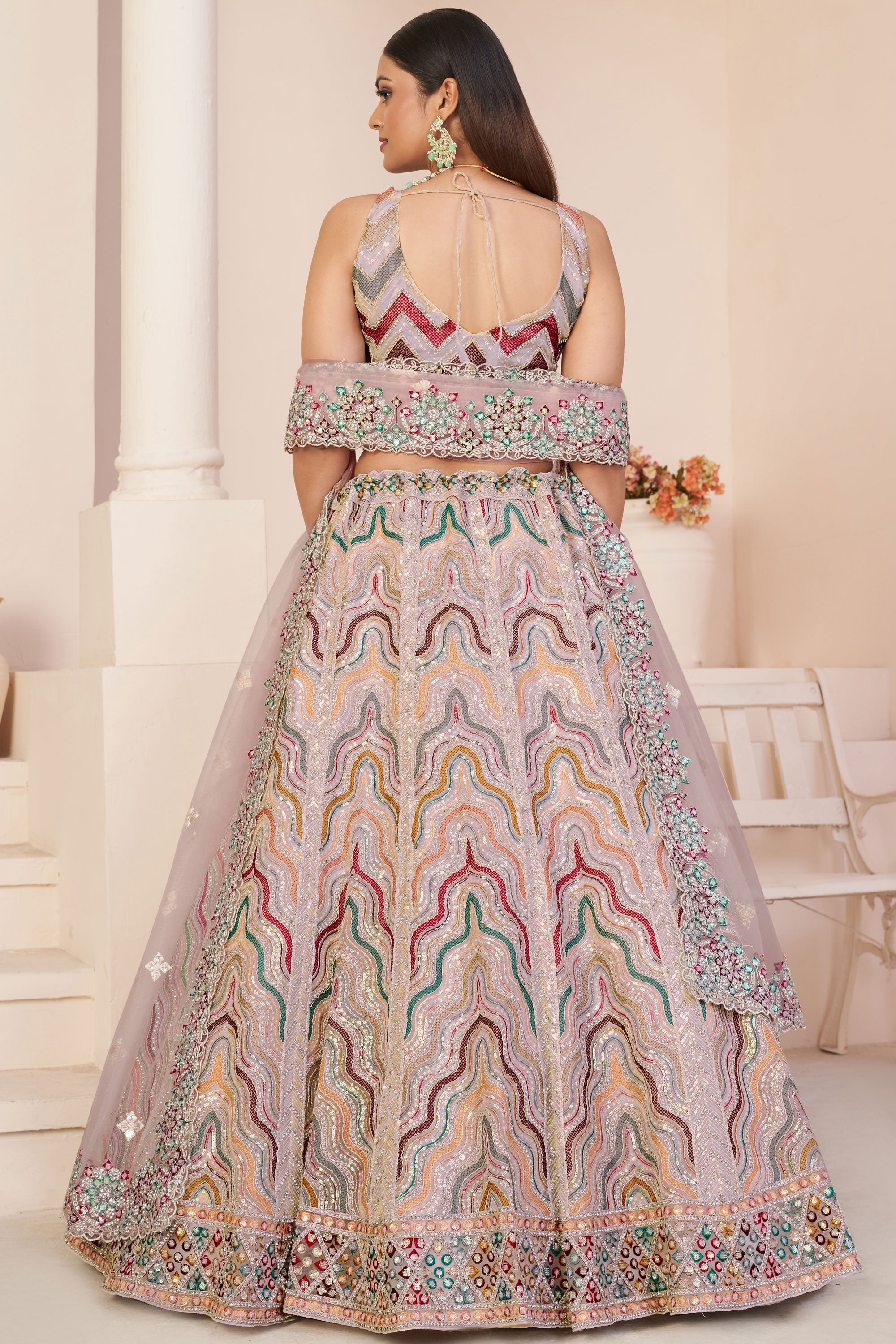 Embroidered Peach Color Bridal Lehenga Choli In Net Fabric