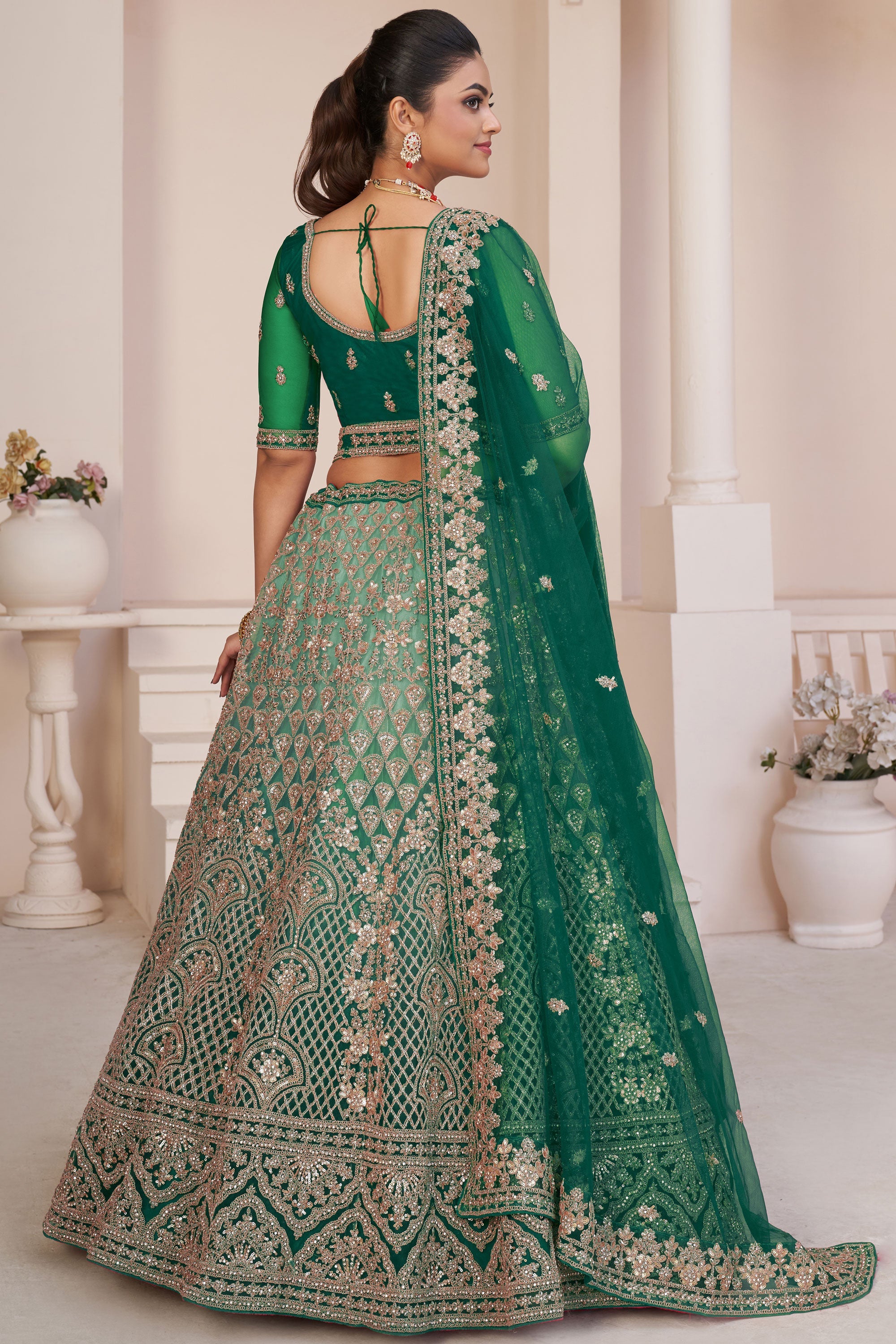 Embroidery Work Net Fabric Bridal Lehenga Choli In Green Color