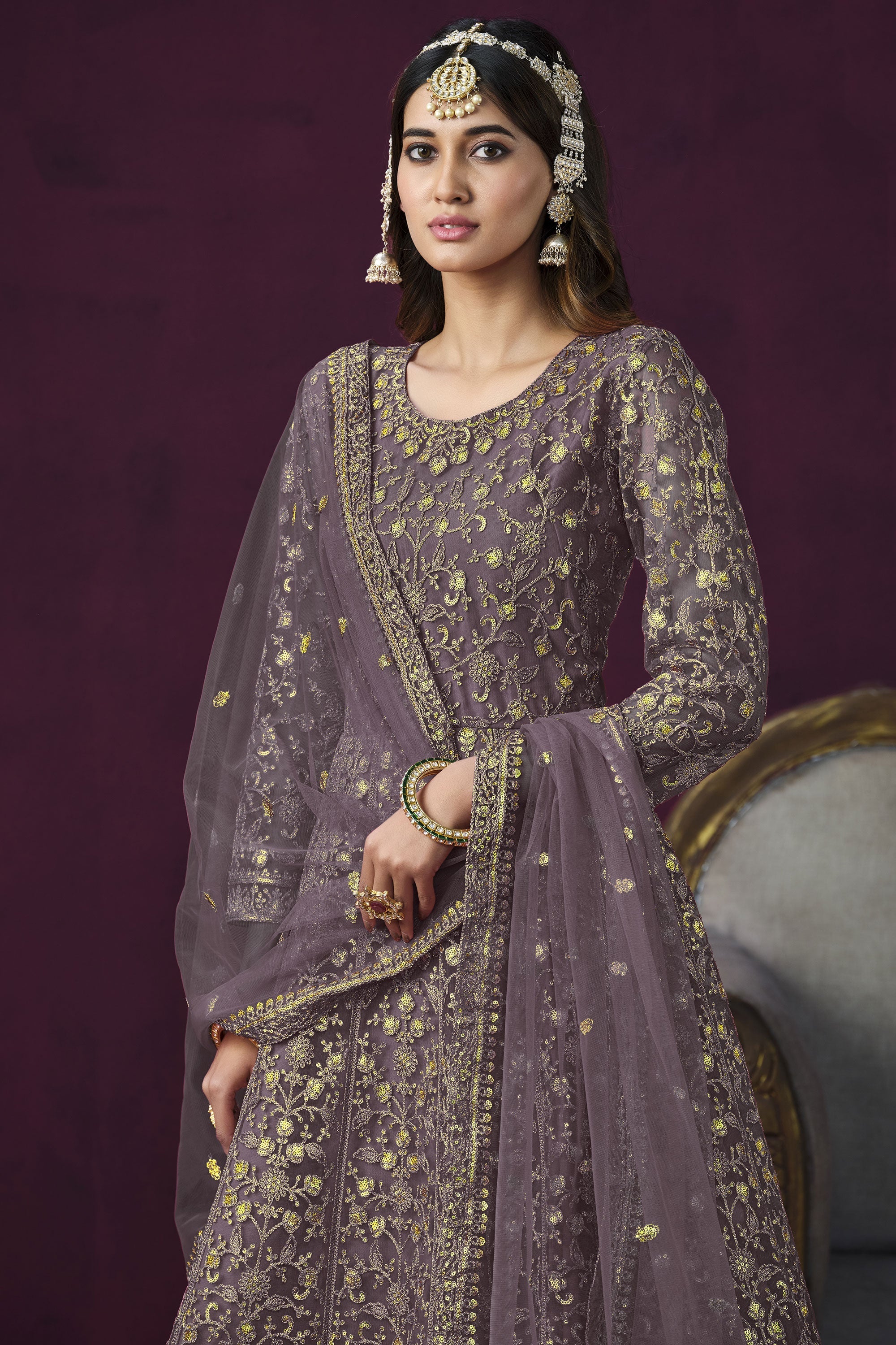 Attractive Embroidered Lavender Color Anarkali Suit In Net Fabric