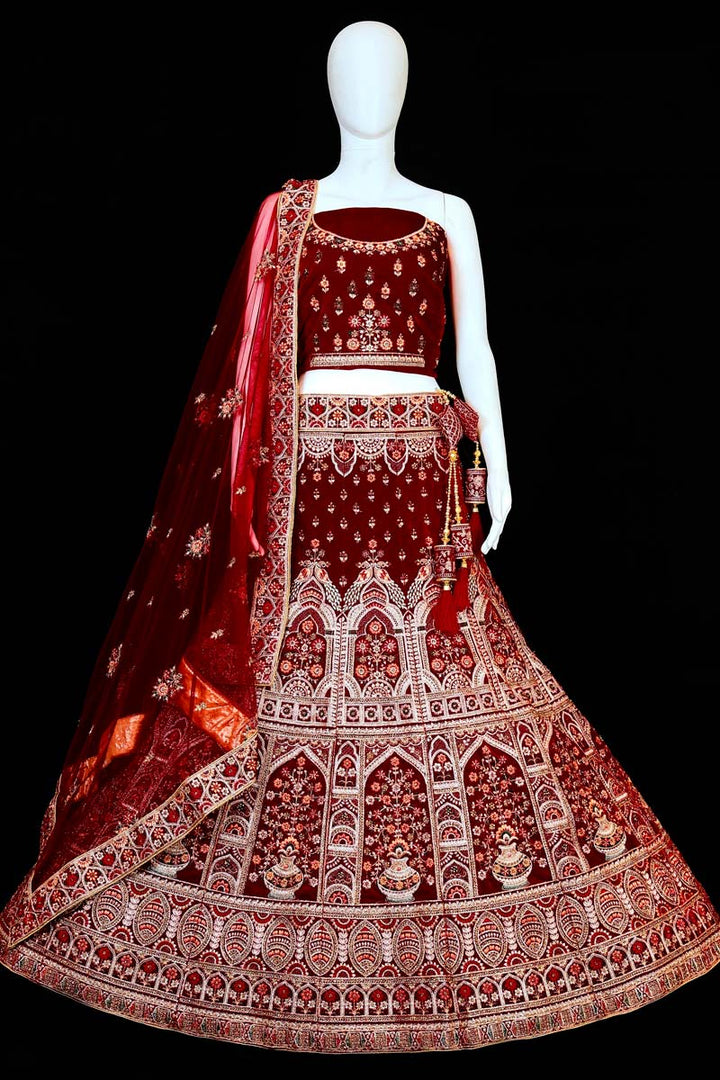 Charismatic Maroon Color Wedding Wear Embroidered Work Bridal Lehenga In Velvet Fabric