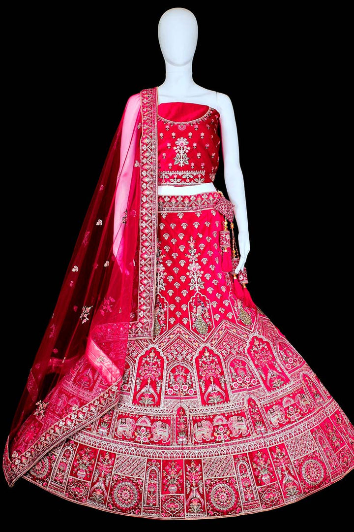 Wedding Wear Velvet Fabric Rani Color Ravishing Bridal Lehenga With Embroidered Work