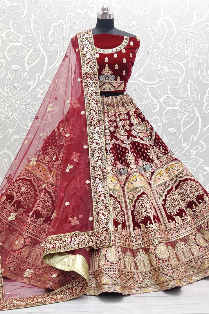 Pleasant Velvet Fabric Bridal Lehenga In Maroon Color