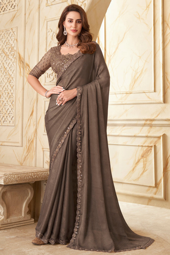 Fetching Border Work Silk Saree In Chikoo Color