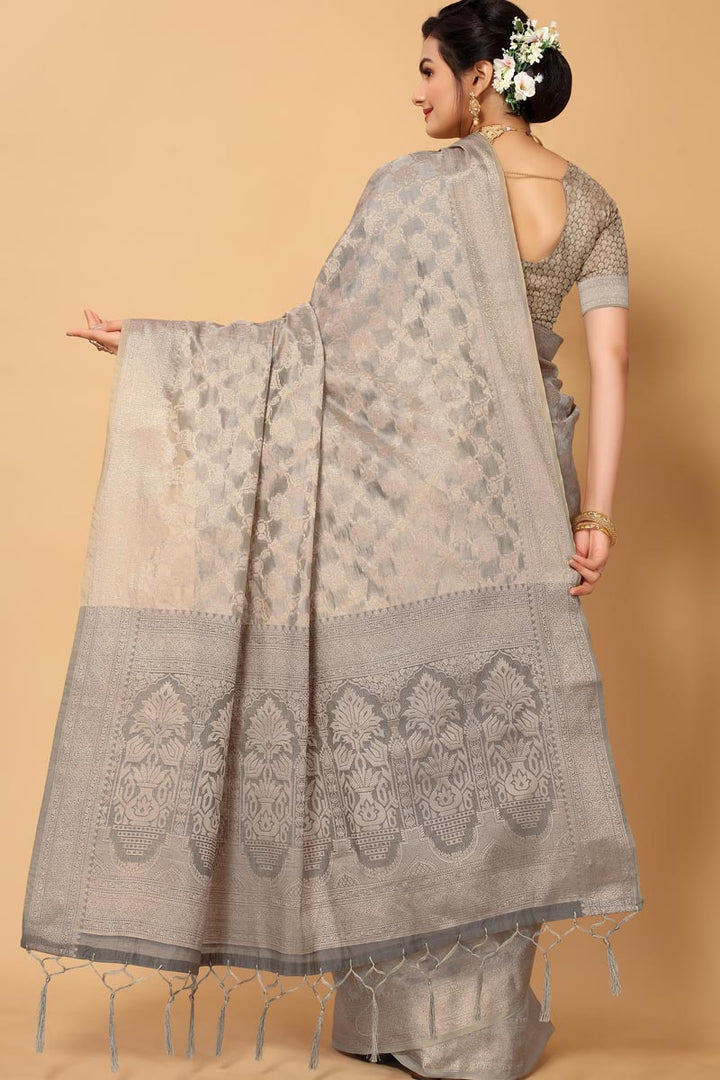 Excellent Function Wear Organza Fabric Grey Color Saree With Weaving Work
