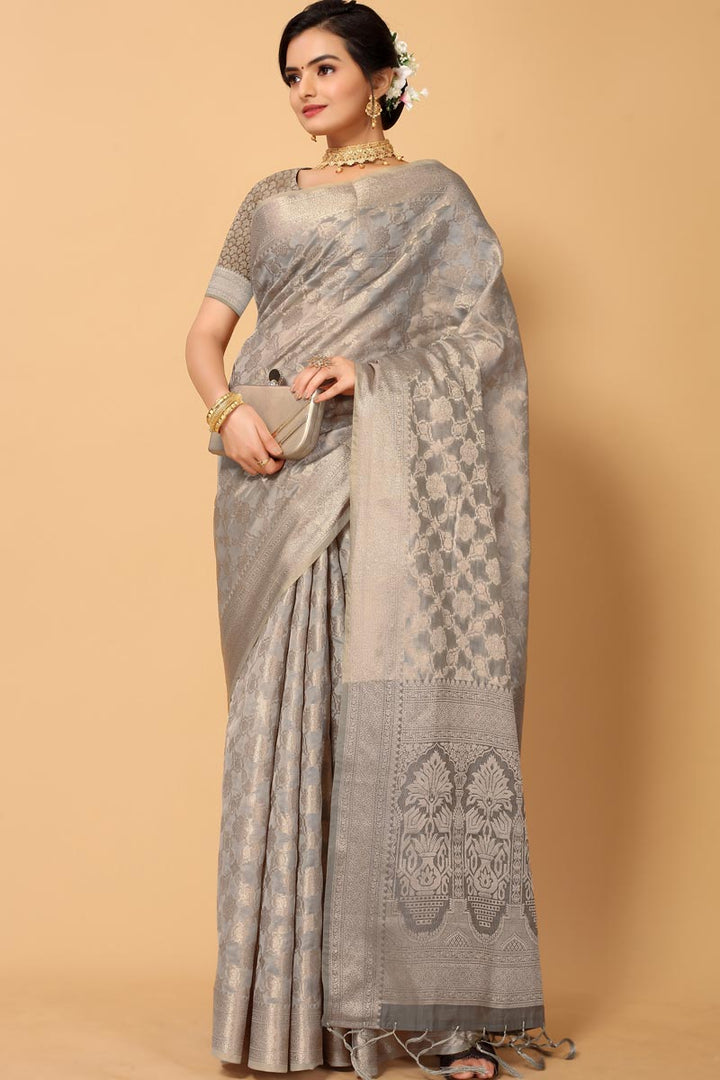 Excellent Function Wear Organza Fabric Grey Color Saree With Weaving Work