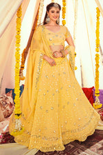 Load image into Gallery viewer, Embroidered Designs On Yellow Color Georgette Fabric Remarkable Lehenga
