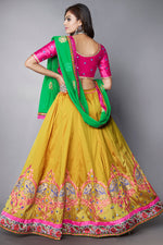 Load image into Gallery viewer, Classic Embroidered Designs On Mustard Color Lehenga In Art Silk Fabric
