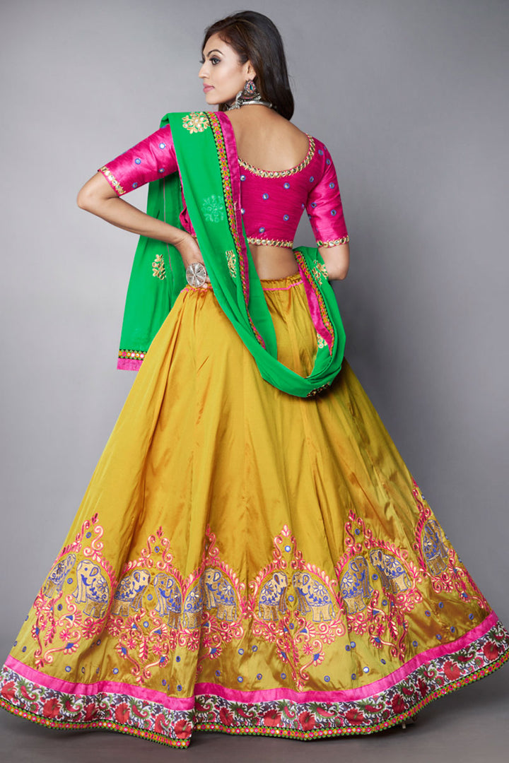 Classic Embroidered Designs On Mustard Color Lehenga In Art Silk Fabric