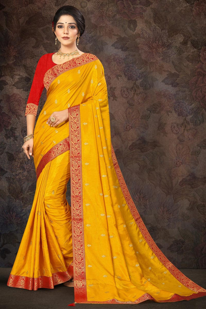 Wedding Wear Yellow Color Fancy Art Silk Fabric Lace Work Saree