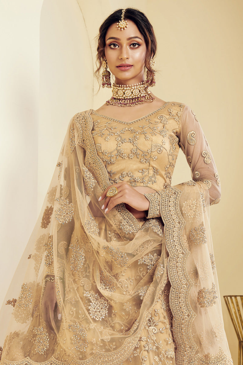 Net Fabric Sangeet Wear Fancy Golden Color Embroidered Lehenga