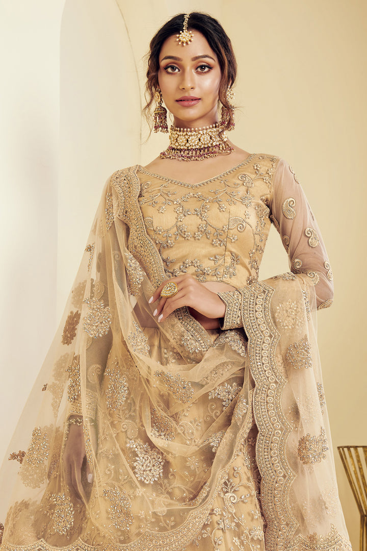 Net Fabric Sangeet Wear Fancy Golden Color Embroidered Lehenga