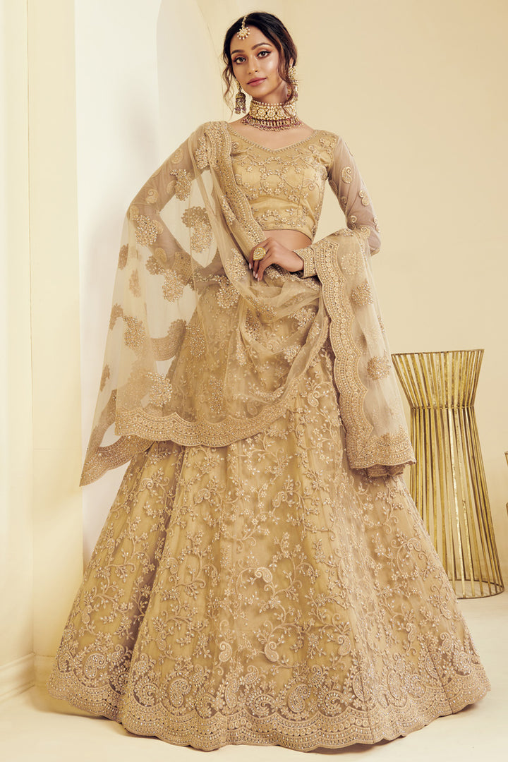 Net Fabric Sangeet Wear Fancy Golden Color Embroidered Lehenga