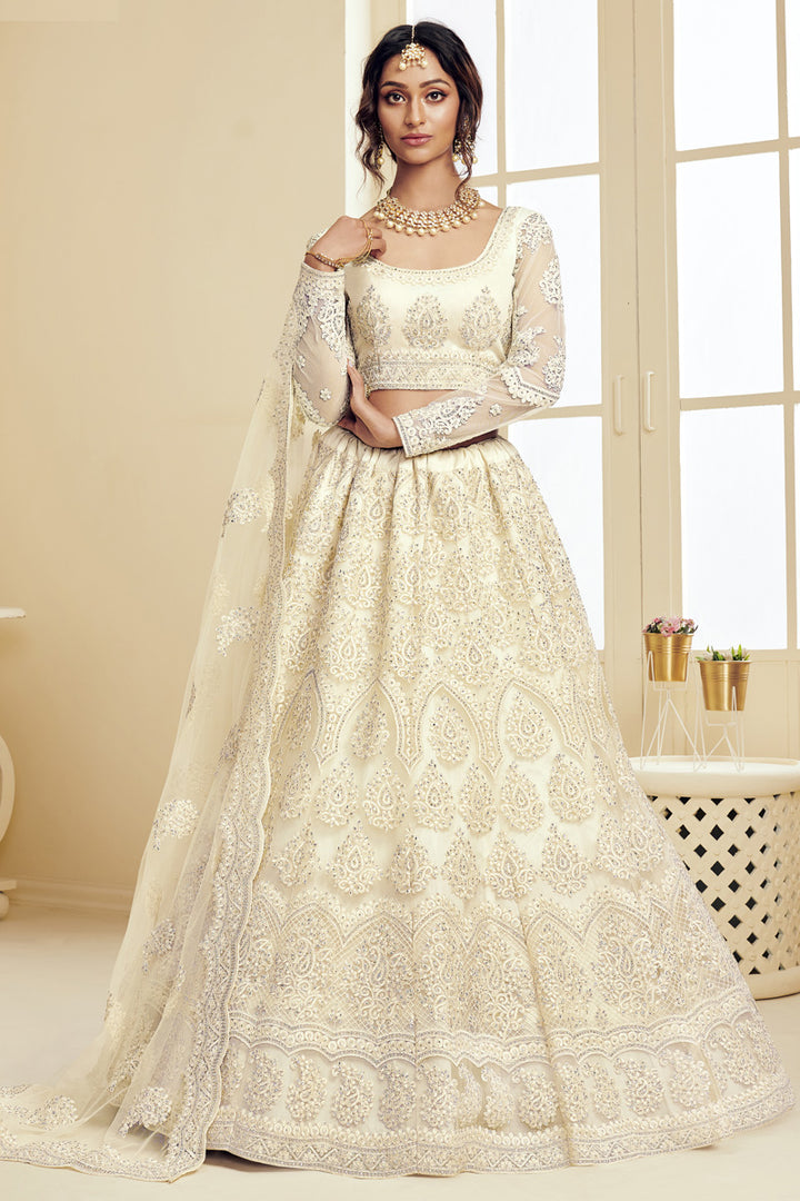 Sangeet Wear Fancy Off White Color Embroidered Net Fabric Lehenga Choli