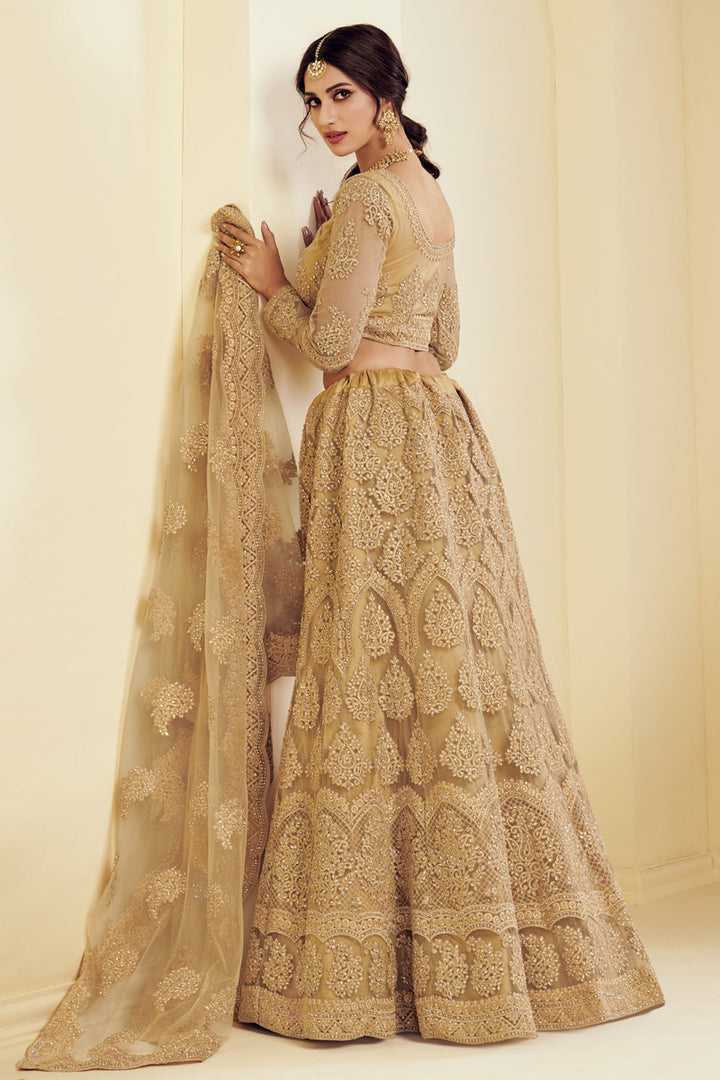 Fancy Golden Color Sangeet Wear Embroidered Net Fabric Lehenga